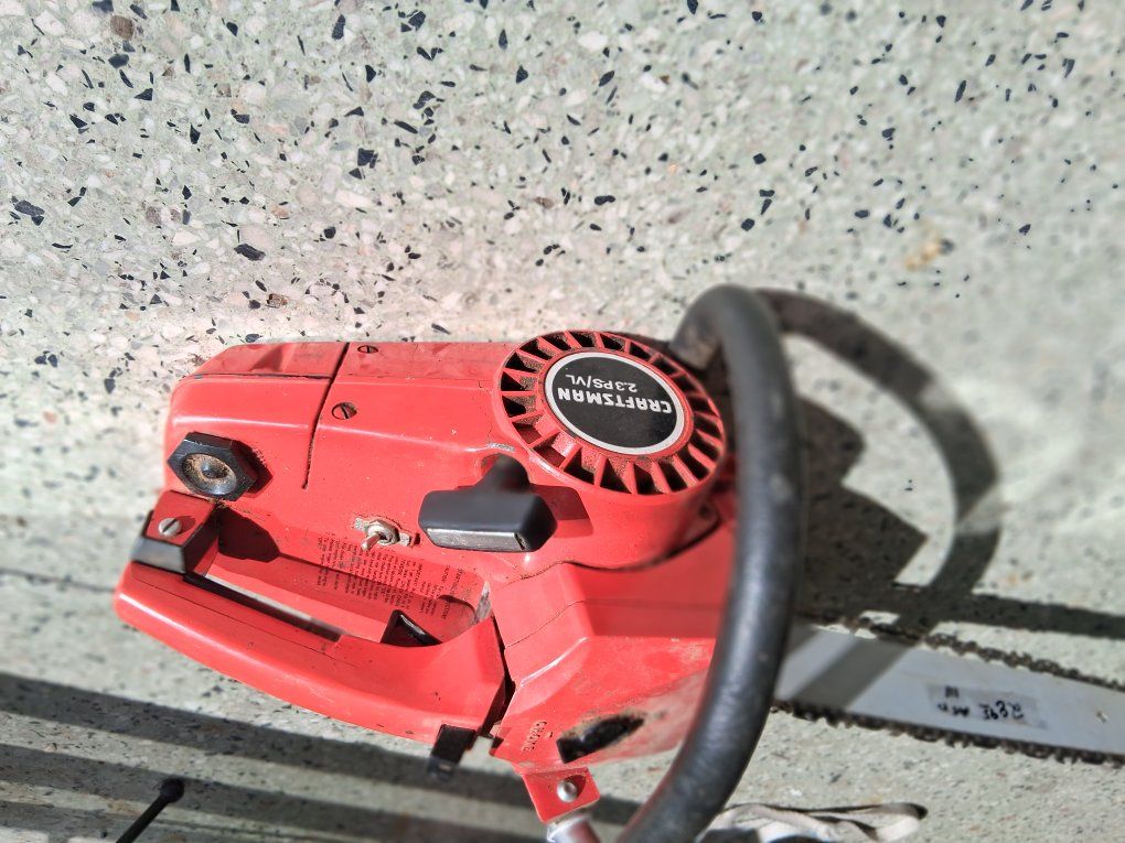 VINTAGE CRAFTMANS CHAIN SAW red