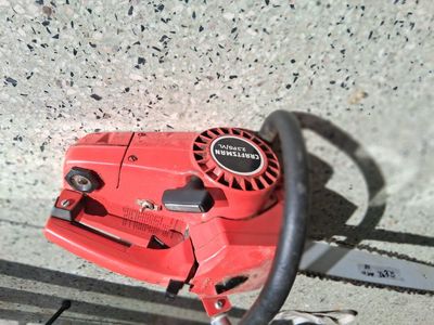 VINTAGE CRAFTMANS CHAIN SAW red