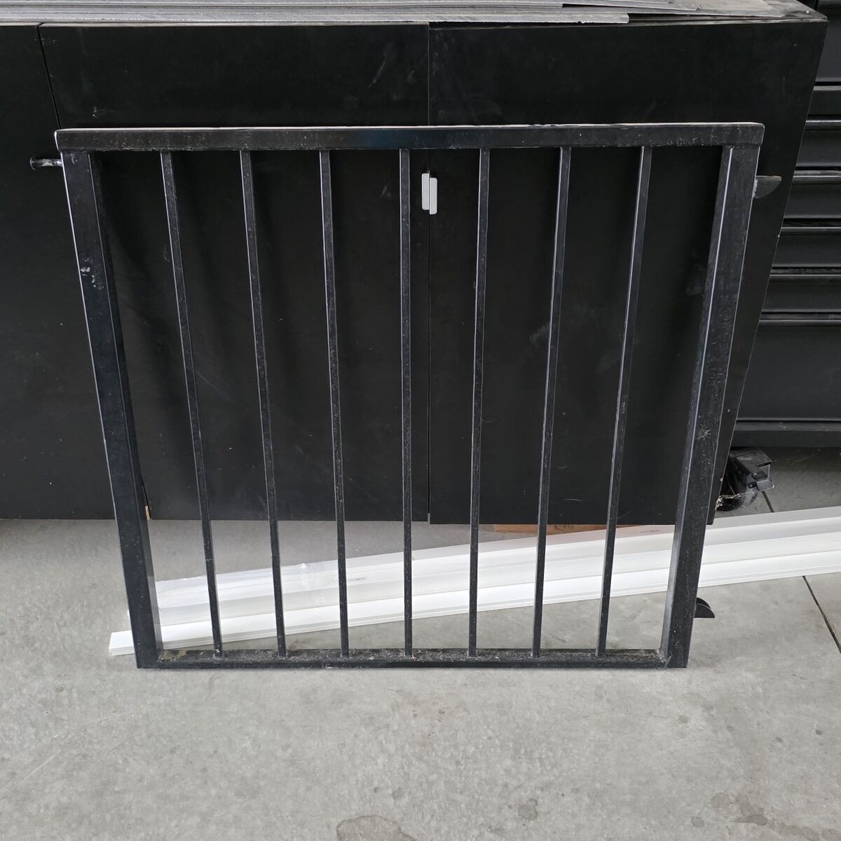 Metal gate previously used on a deck.