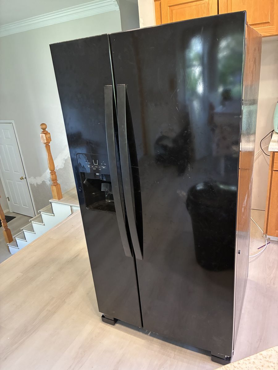 Black Whirlpool fridge freezer combo side by side