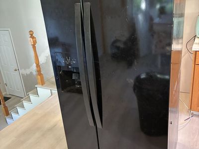 Black Whirlpool fridge freezer combo side by side