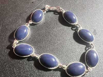 Silver-Toned Oval Link Bracelet with Blue Cabochon Stones - Elegant Statement Piece