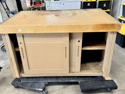 Vintage Wooden Workbench Cabinet with Sliding Doors and Storage Shelves $10