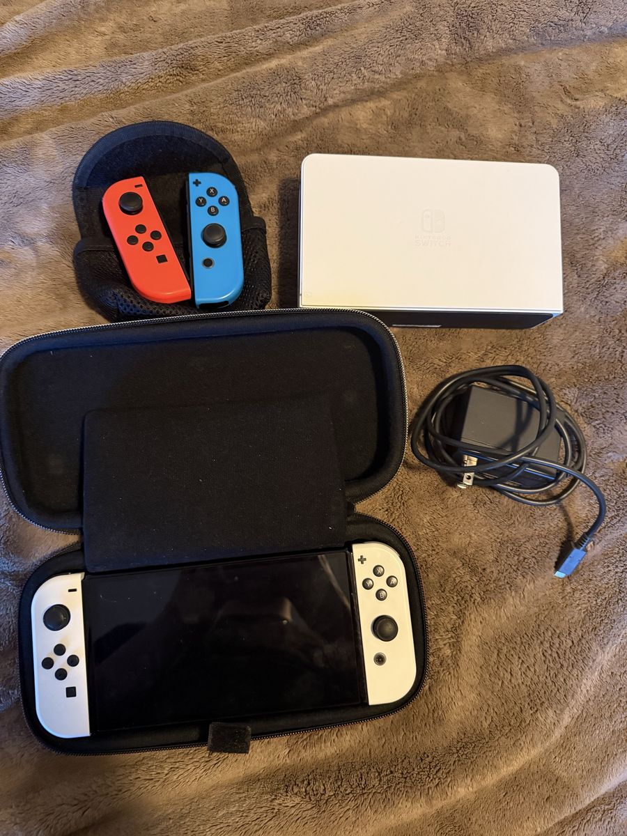 Nintendo switch OLED with case, charger, and extra joycons