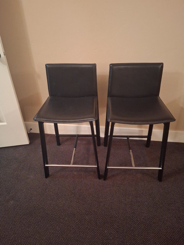 Set of 2 Black faux leather upholstered Counter height Stools with Metal Footrests