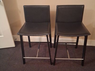 Set of 2 Black faux leather upholstered Counter height Stools with Metal Footrests