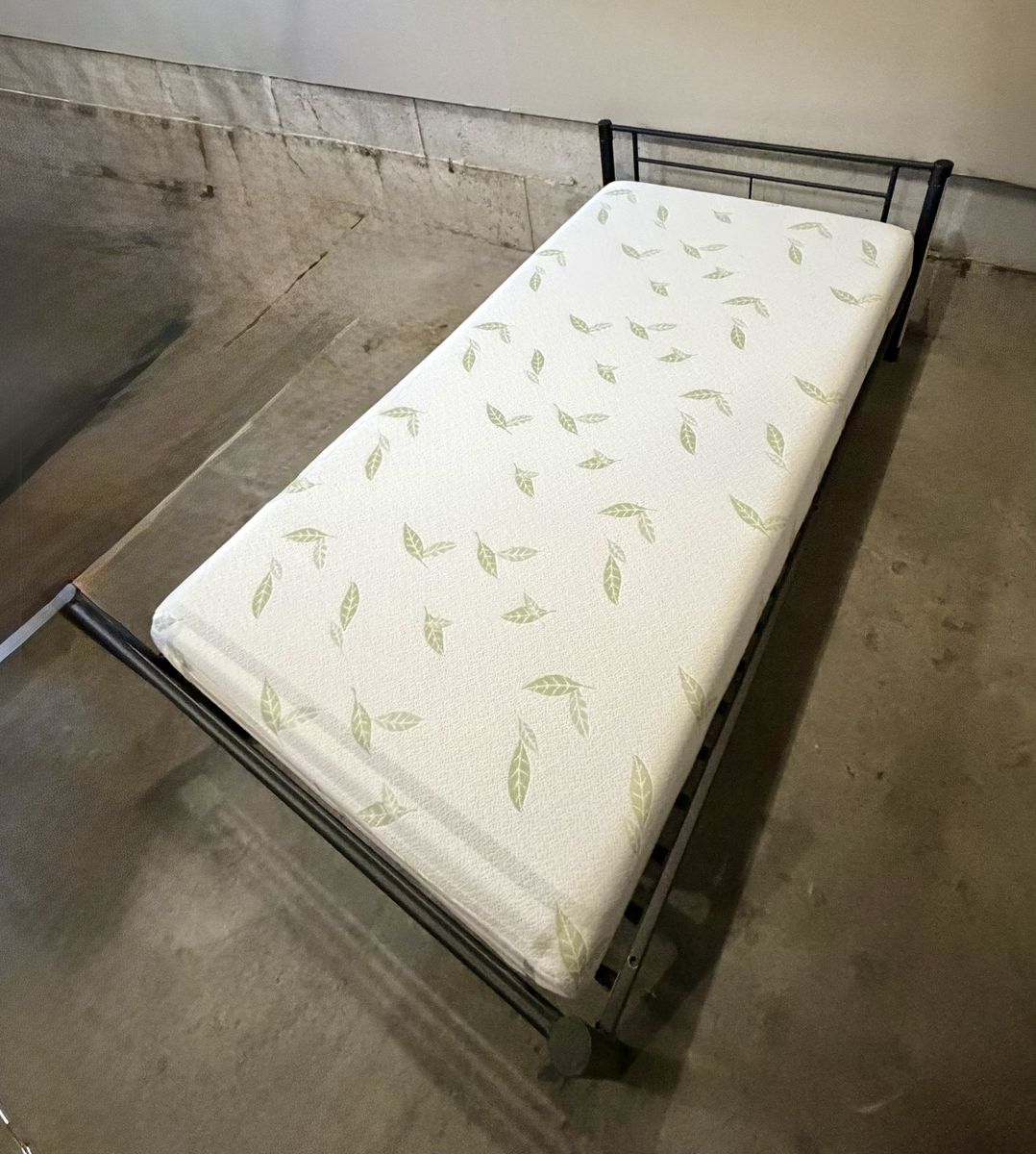 Black Metal Twin Bed Frame with Green Leaf Pattern Mattress