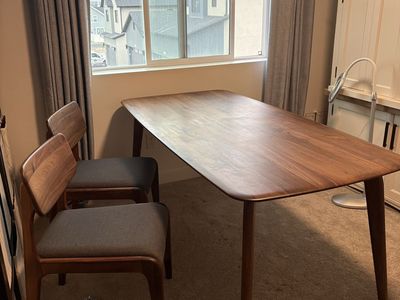 Modern Wooden (walnut) Dining Table with Rounded Corners and four chairs. Made by Castlery