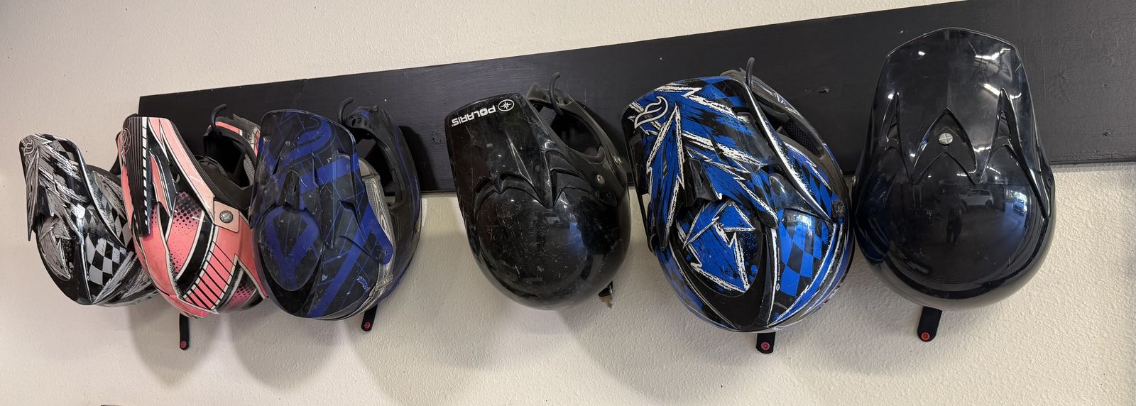 Six snowmobile helmets