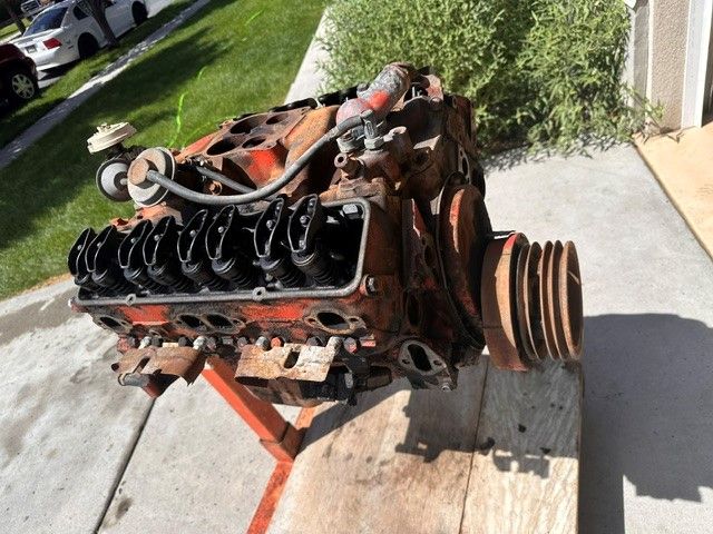 400 Small Block Chevy (SBC), V8  (Hard to find 509 casting w/ 2 Bolt Main) with accessoroies, Engine Lift, and Stand.