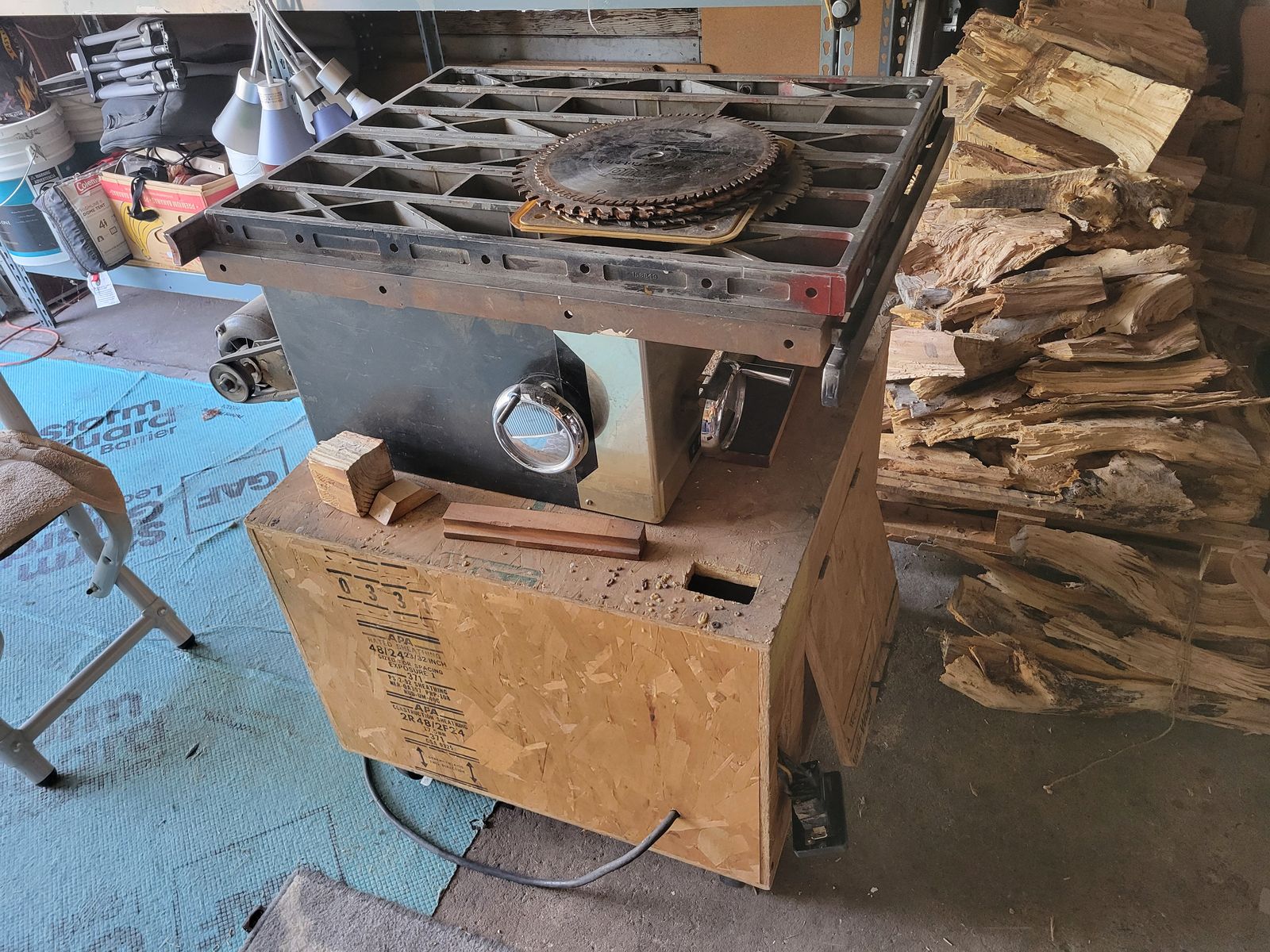 Table saw with metal shelf and sawdust box