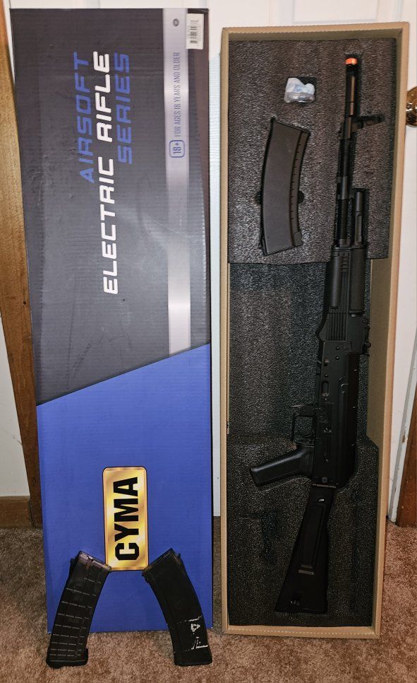 CYMA Sport AK-74 Electric Airsoft Rifle Series with 2 extra magazines included. Battery required.