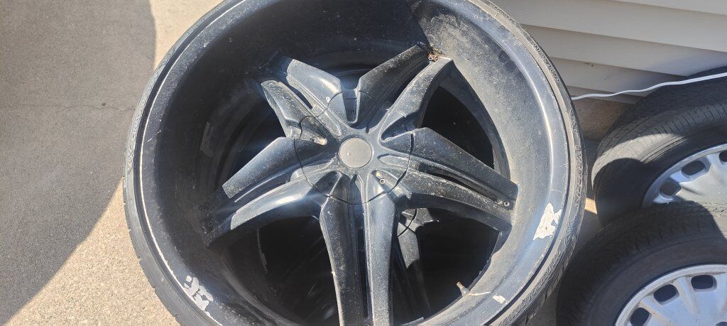 Three 24" black wheels with lip. LAST TIME LISTING