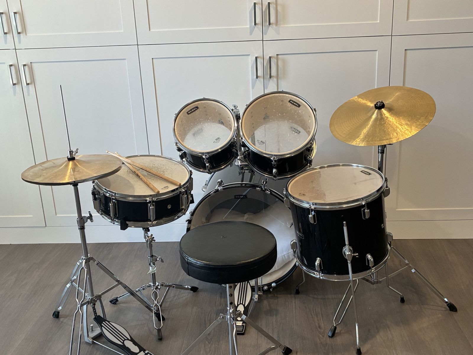 Rebel drum set in Black with Hardware, Cymbals, and Throne
