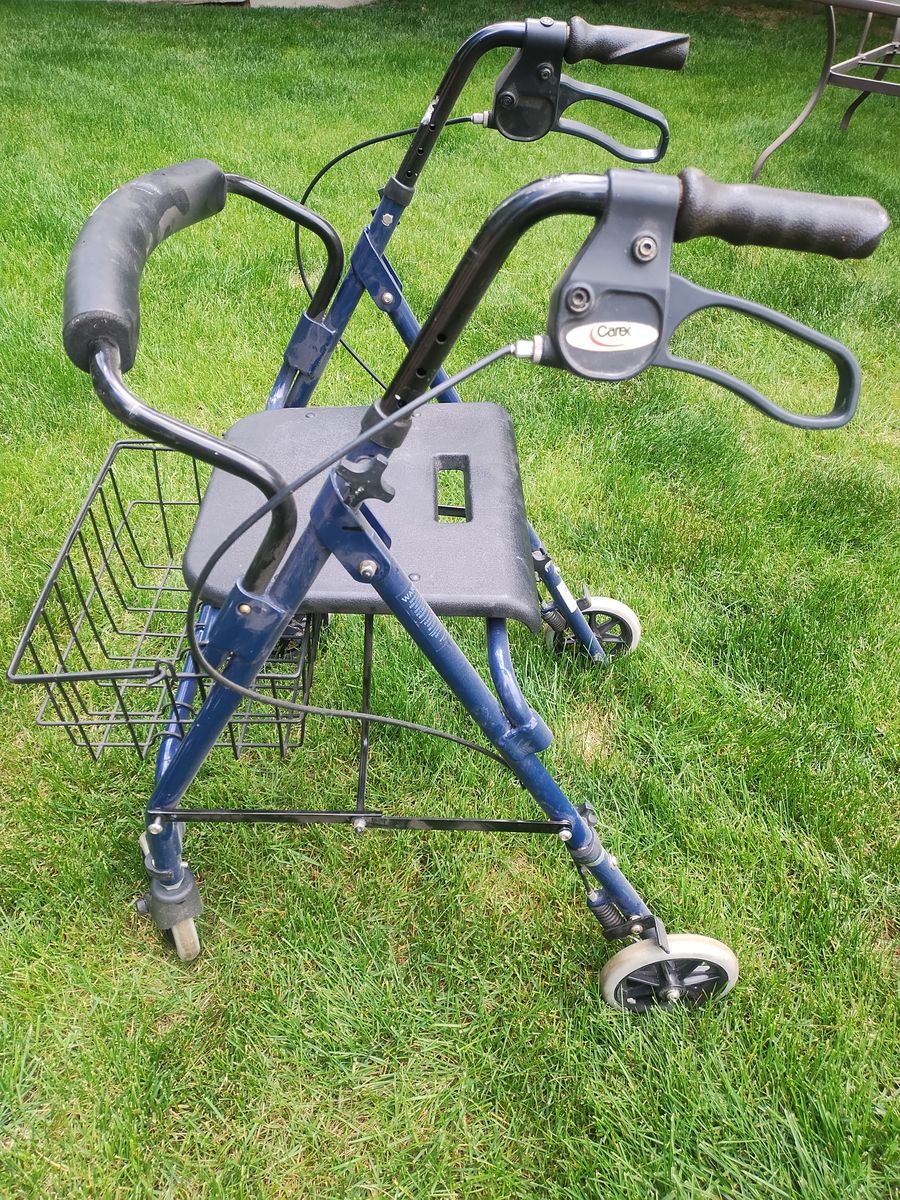 Walker with wheels, seat and basket