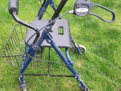 Walker with wheels, seat and basket