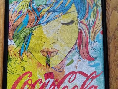 21"x 29" Coca-Cola art deco look framed puzzle. Gr