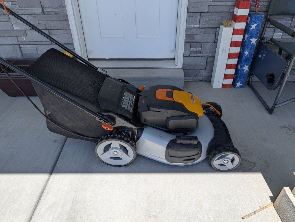 power lawn mower, weed eater and leaf blower with two batteries and charger. dock pretty good condition 2 years old
