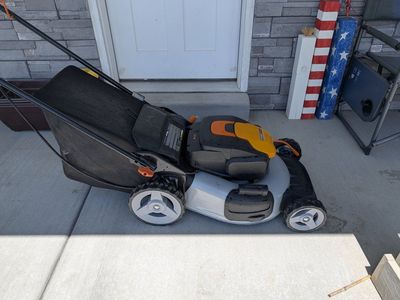 power lawn mower, weed eater and leaf blower with two batteries and charger. dock pretty good condition 2 years old