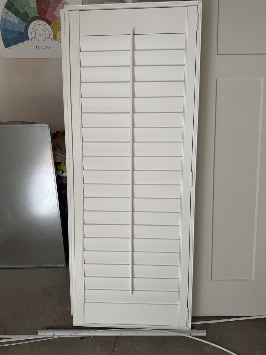 Door mounted shutters