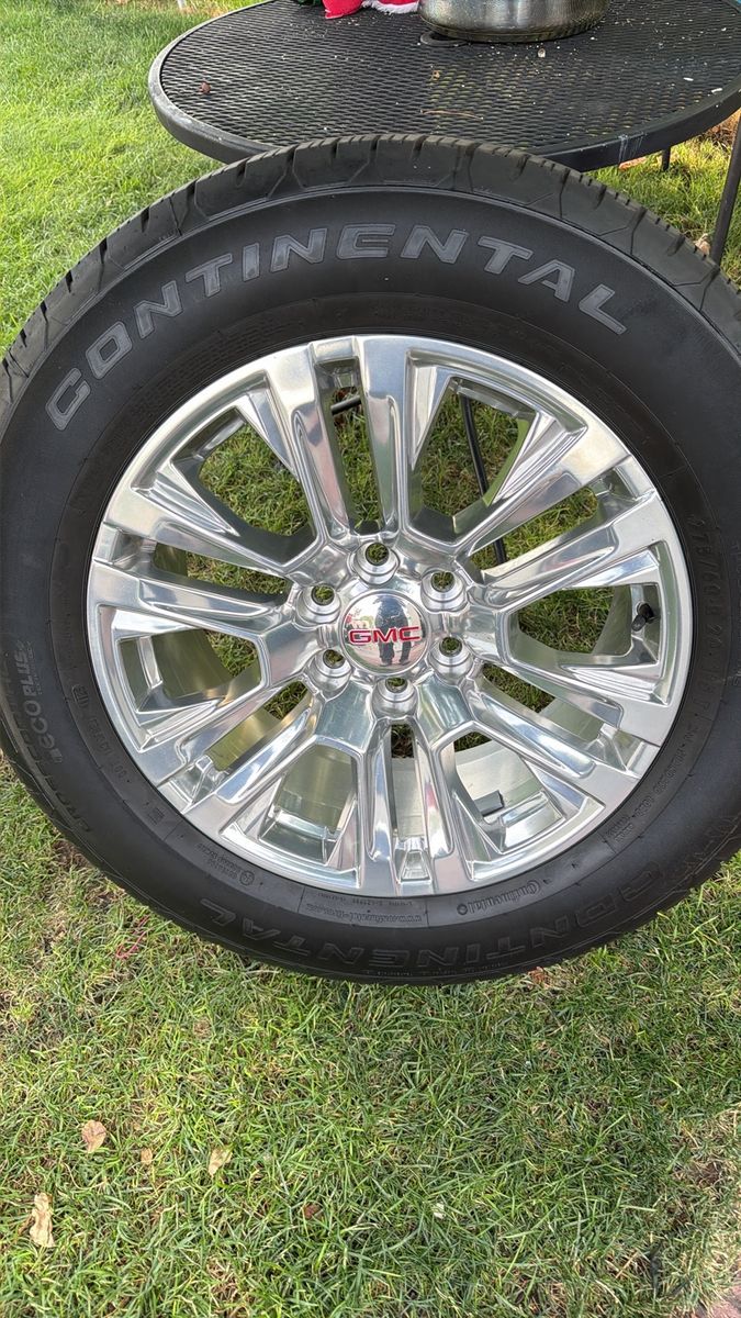 Like new GMC sierra 1500 wheels and tires 