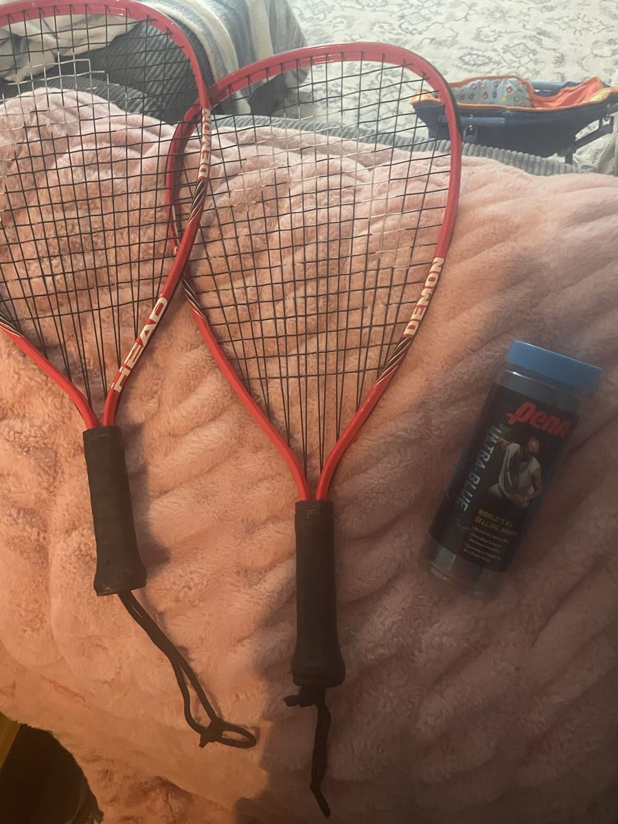 Two racquets and balls. 