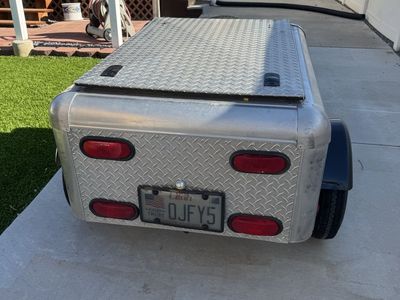 Cargo trailer can be towed behind a car or motorcycle etc.