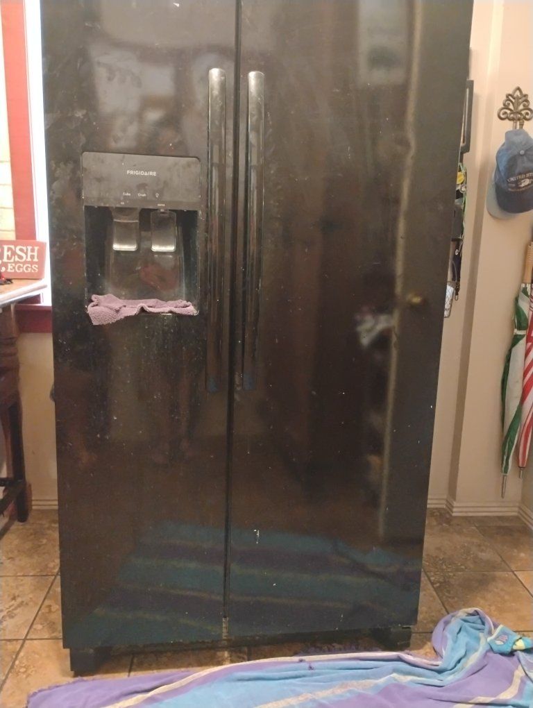 Free Frigidaire Side-by-Side Refrigerator Freezer w/ Ice Maker - Black, 69 7/8" H x 35 7/8" W