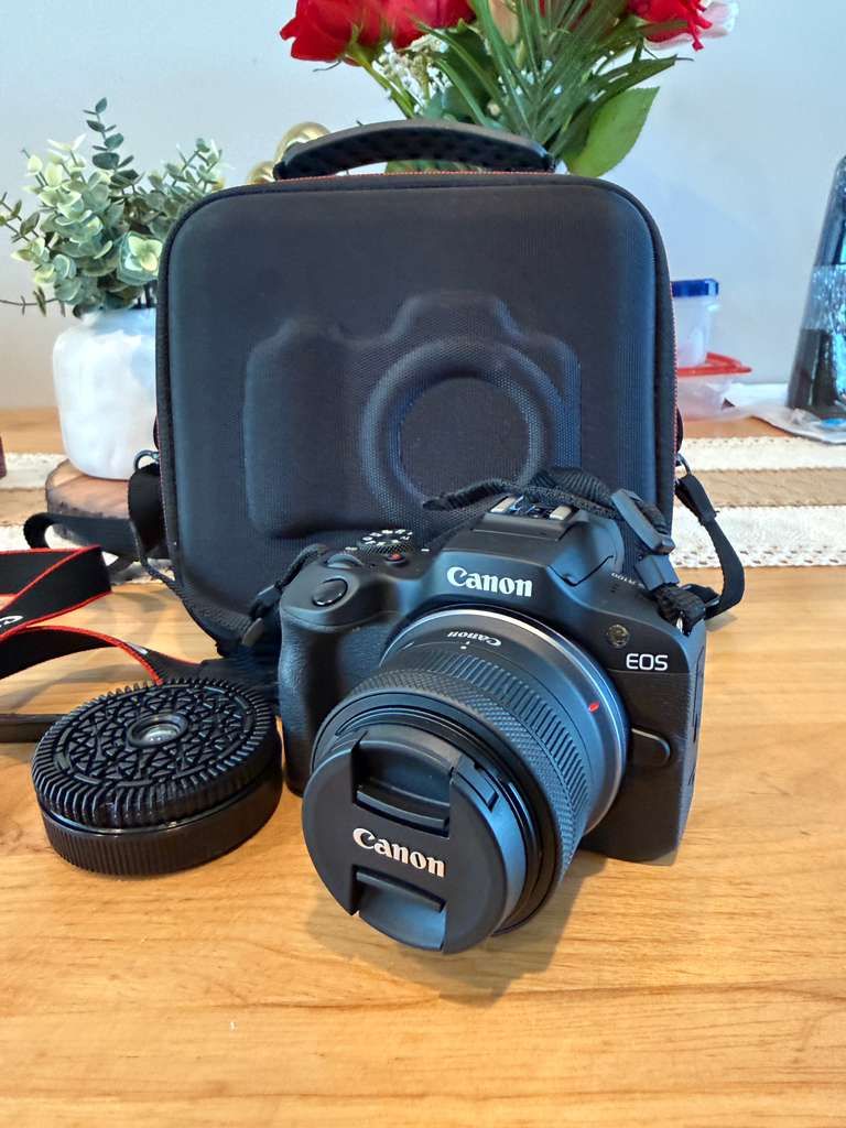 Canon EOS R100 with Canon RF-S 18-45mm lens and case
