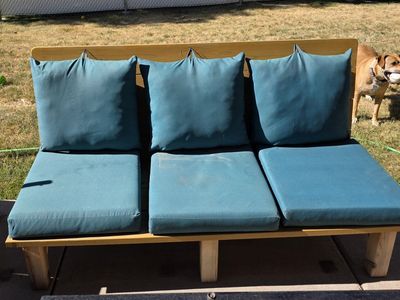 2 outdoor benches with cushions.