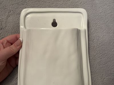 Wall-mounted storage pocket