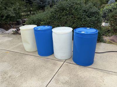 55 Gallon Water Storage Barrels - Blue and White Plastic Drums