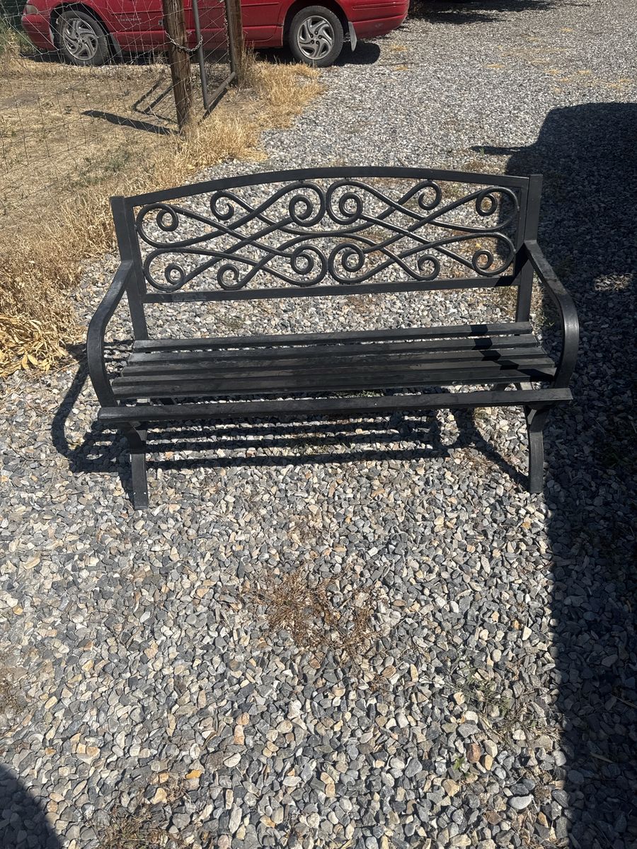 Black Metal Garden Bench with Decorative Scrollwork Back