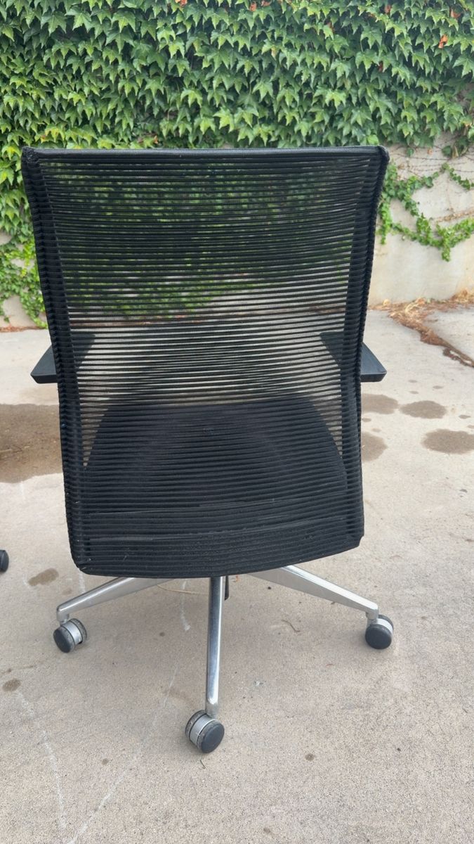 Black Mesh Office Chair with Adjustable Arms and Rolling Base