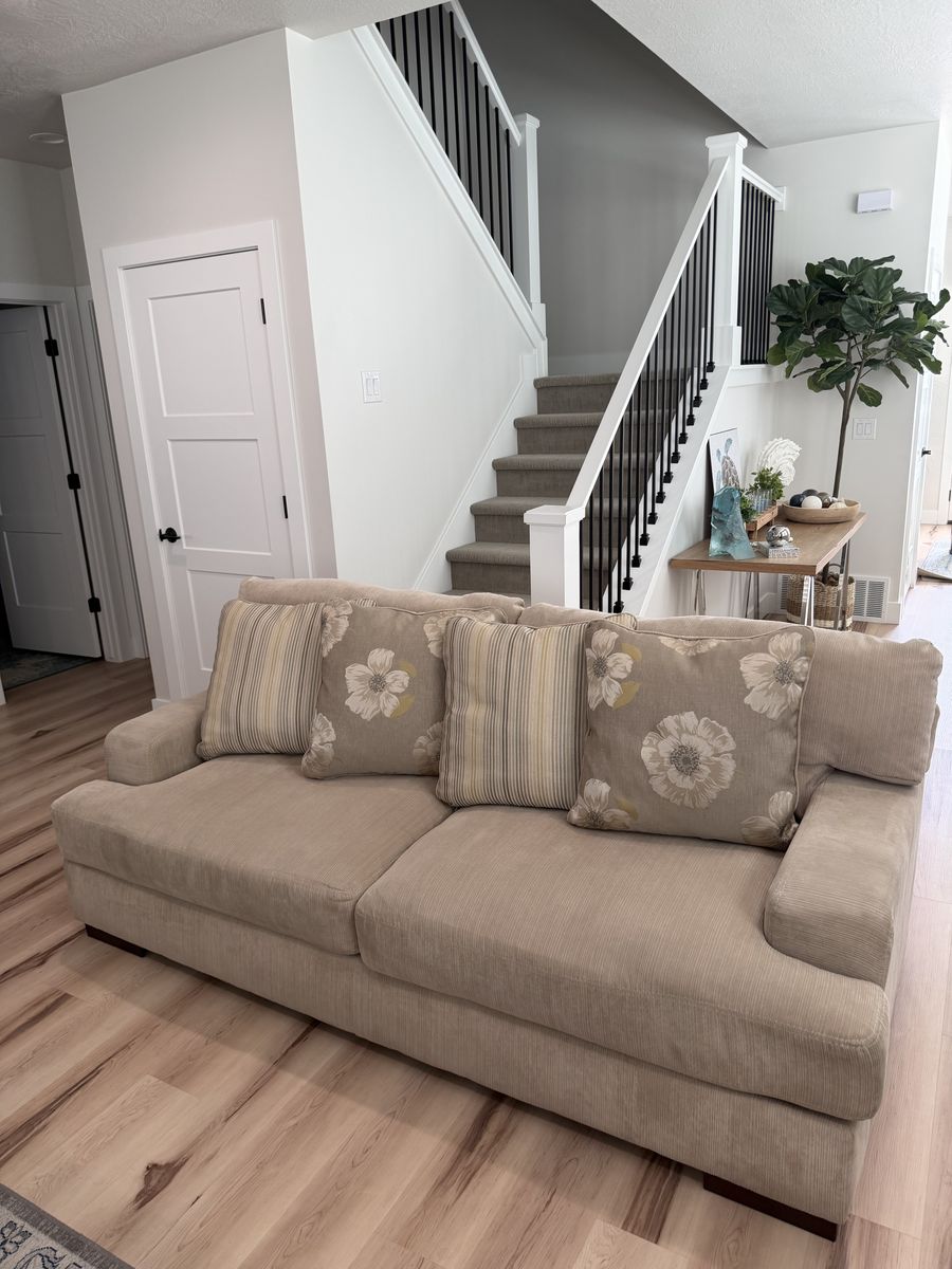 Cream couch with reversible pillows!