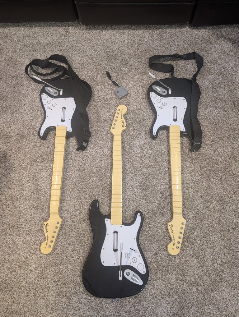 3 PlayStation Rock Band Guitars + 1 dongle