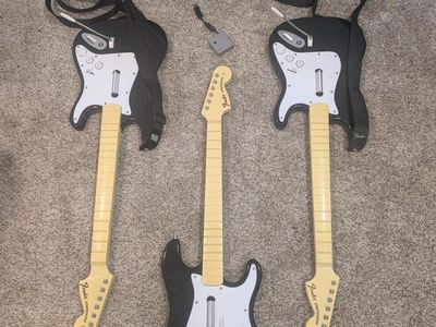 3 PlayStation Rock Band Guitars + 1 dongle
