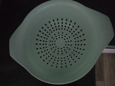 Green Plastic Kitchen Colander Strainer with Dual Handles, plate and bowl