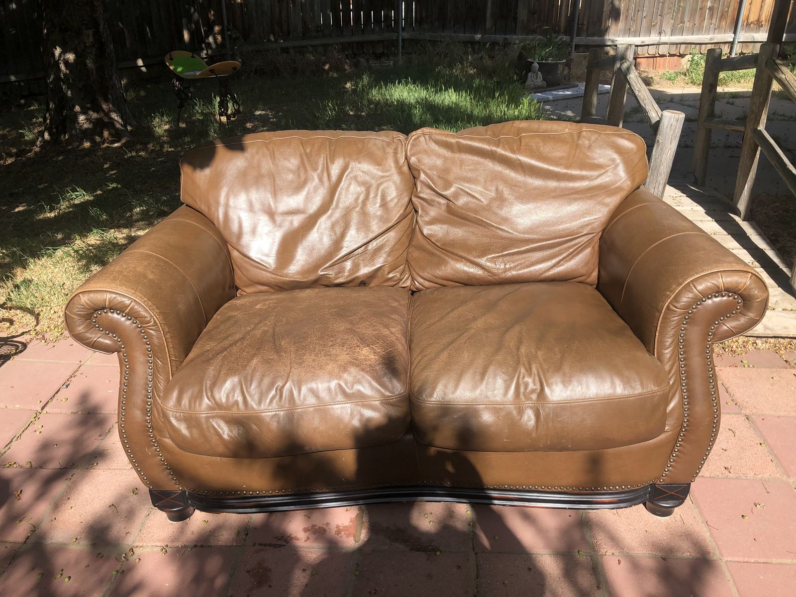 Very well made, solid wood, beautiful, thick brown leather, love seat couch.