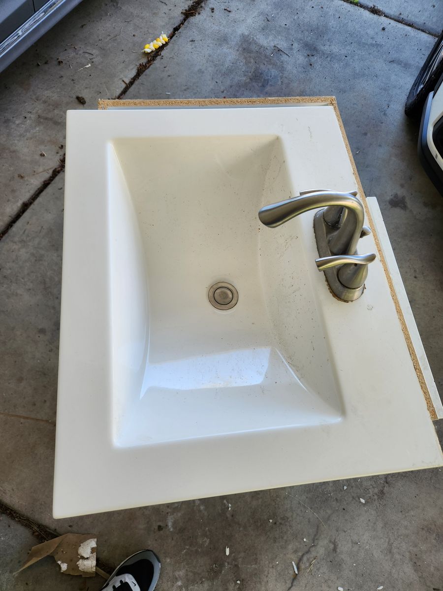 Bath/shower basin/walls, Vanity with sink and Drain