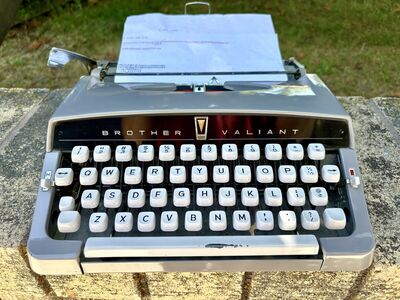 Vintage 1960’s manual portable typewriter by Brothers Valiant. Works great Mid Century Modern styling MCM