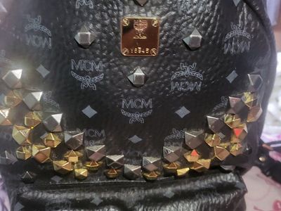 MCM Stark Studded Backpack Black Visetos Leather Gold and Silver Studs