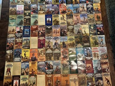 Louis Lamour Vintage Paper Back and hardcover Books,128 of them. Plus 4 cassettes.