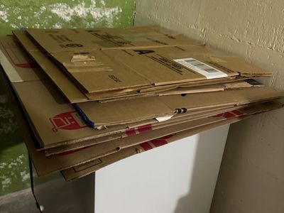 Assorted Cardboard Moving Boxes Stacked Flat