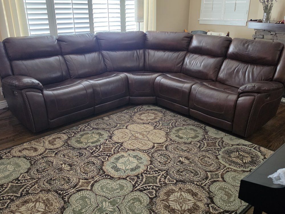 Brown Genuine Leather Power Reclining Sectional Sofa with 3 Adjustable seats and headrests from Ashley furniture