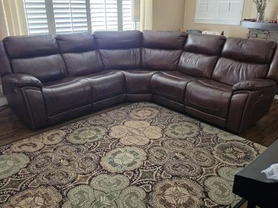 Brown Genuine Leather Power Reclining Sectional Sofa with 3 Adjustable seats and headrests from Ashley furniture