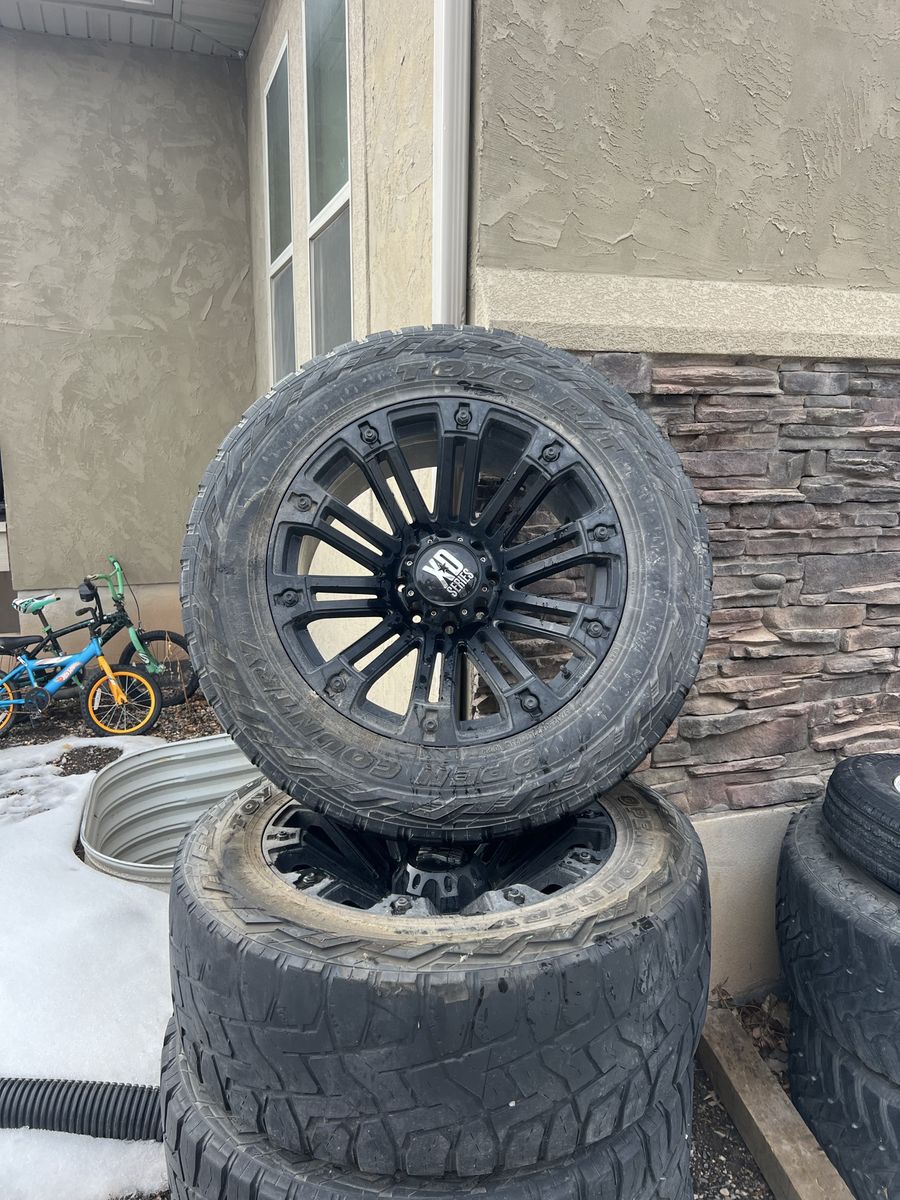 Toyo Open Country R/T 37x12.50R22LT Tires with XD Series Black Wheels