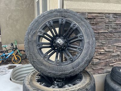 Toyo Open Country R/T 37x12.50R22LT Tires with XD Series Black Wheels