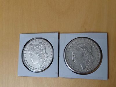Two Silver Dollars Uncirculated. Beautiful. Cash Only Text 385-414-9627. $150.00 for both.