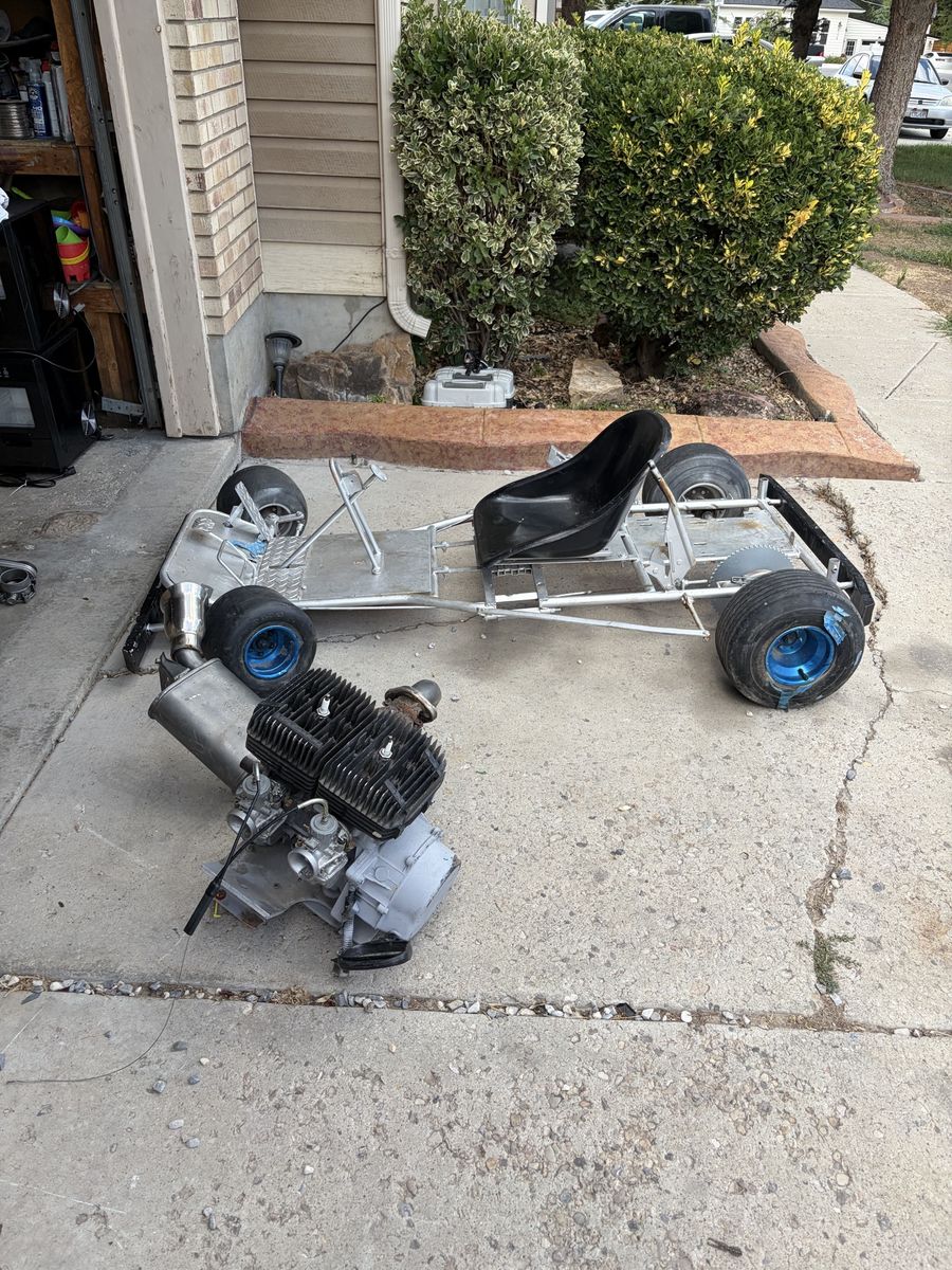 Go kart frame and Used Small Engine with Carburetor and Exhaust System. Looking for mini bike trade